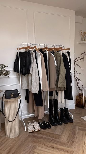 Organized capsule wardrobe with neutral clothes and shoes.