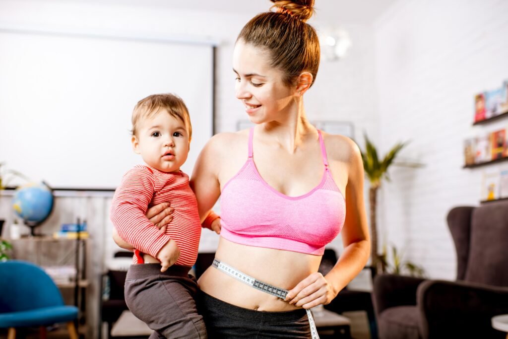 Mother holding her baby while embracing a healthy postpartum lifestyle.