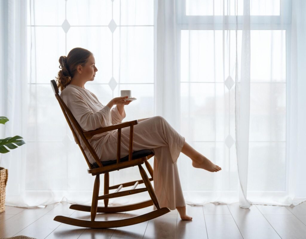 A peaceful woman enjoying a quiet morning with tea in a minimalist home.
